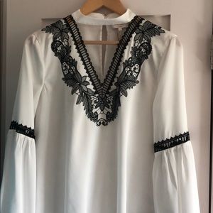 Dressy white long sleeved top black lace detail